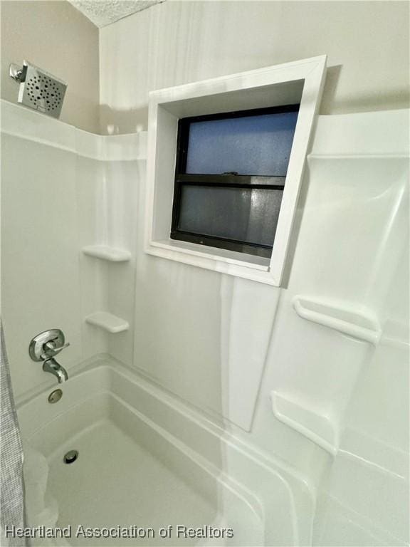 bathroom with shower / bathing tub combination