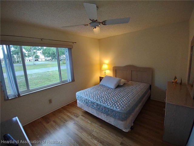 160 Parkview Cir, Lake Placid, FL 33852 - bedroom featuring a textured ceiling, wood finished floors, and ceiling fan