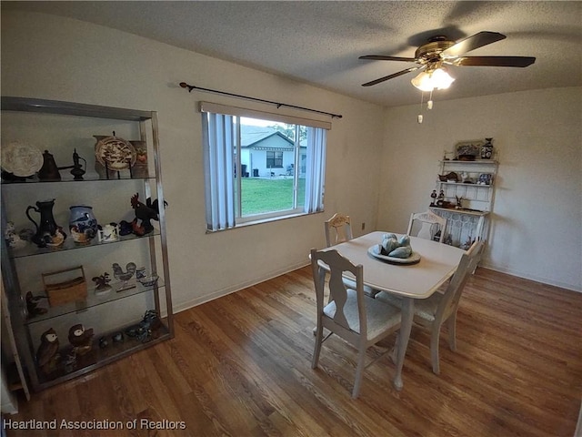 160 Parkview Cir, Lake Placid, FL 33852 - dining space featuring a textured ceiling, ceiling fan, and wood finished floors