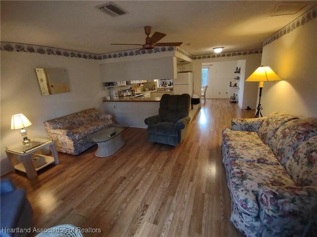 160 Parkview Cir, Lake Placid, FL 33852 - living room featuring wood finished floors, ceiling fan, and visible vents
