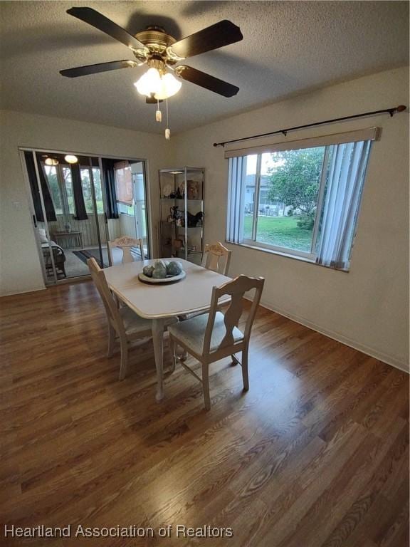 160 Parkview Cir, Lake Placid, FL 33852 - dining room featuring a textured ceiling, ceiling fan, and wood finished floors
