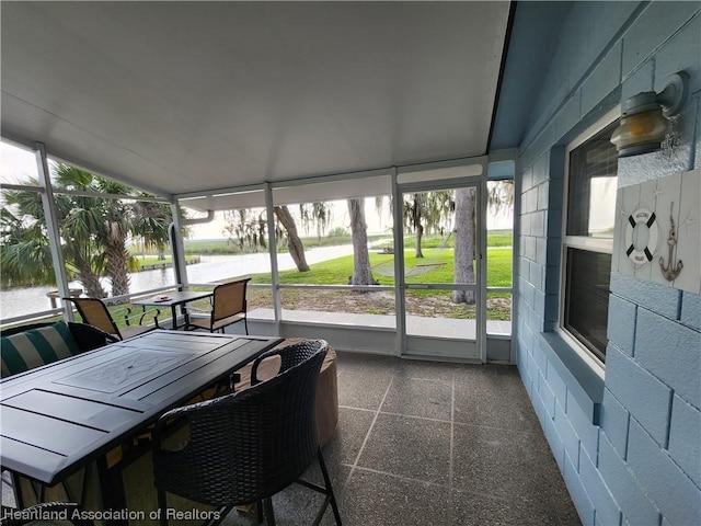 sunroom with a water view