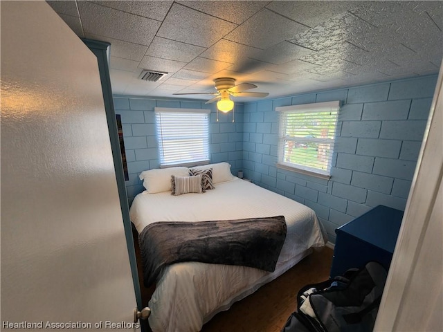 bedroom featuring wood-type flooring and ceiling fan