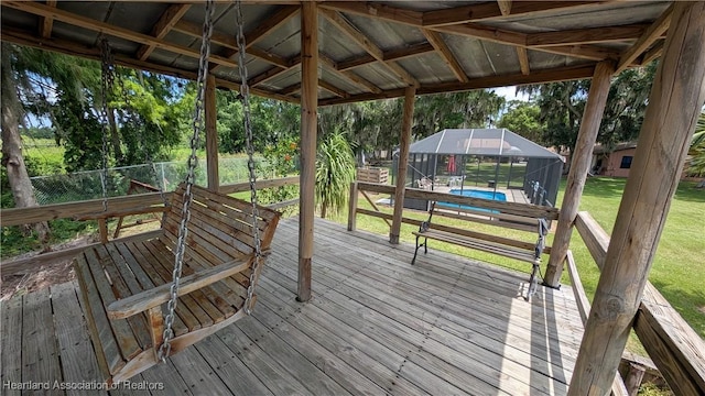 4232 Trails End Rd, Lorida, FL 33857 - wooden terrace featuring an outdoor pool, a yard, a lanai, and view of scattered trees