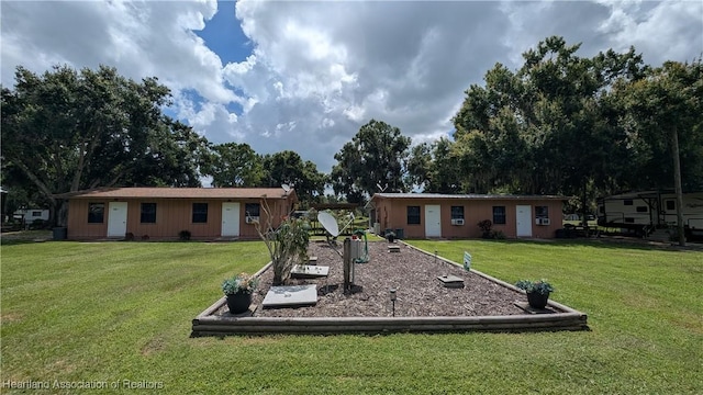 4232 Trails End Rd, Lorida, FL 33857 - rear view of property with a lawn