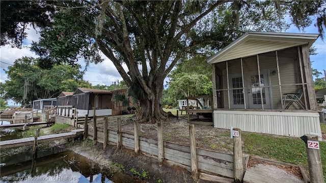 4232 Trails End Rd, Lorida, FL 33857 - view of side of property with a sunroom