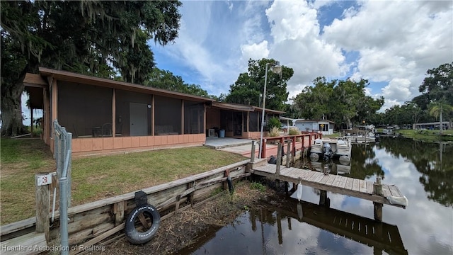 4232 Trails End Rd, Lorida, FL 33857 - dock area with a water view and a lawn