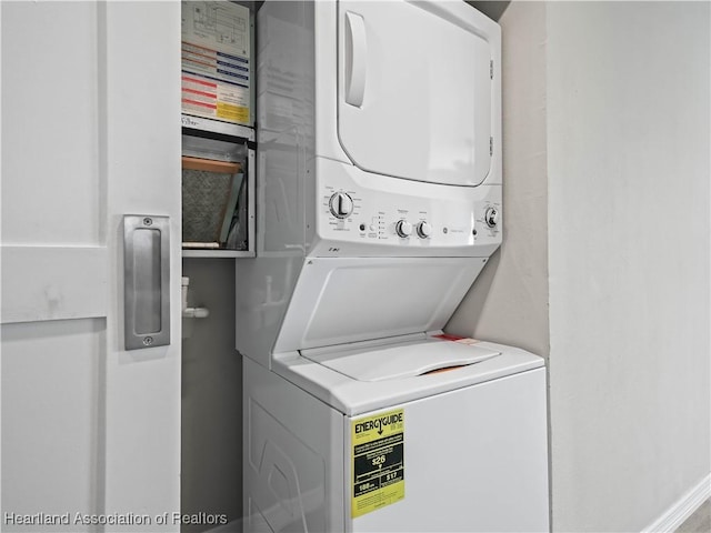 laundry area featuring stacked washer and clothes dryer