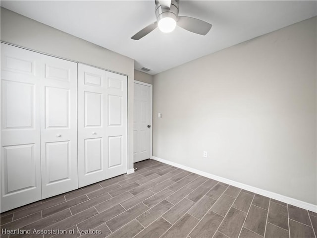 unfurnished bedroom featuring a closet and ceiling fan