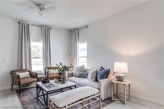 living room featuring a wealth of natural light and ceiling fan