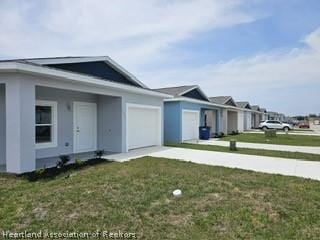 exterior space featuring a front yard and a garage