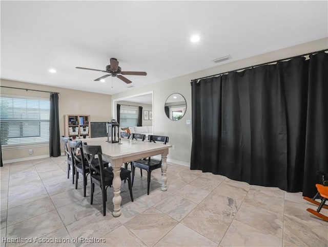 dining room with baseboards, visible vents, ceiling fan, and recessed lighting