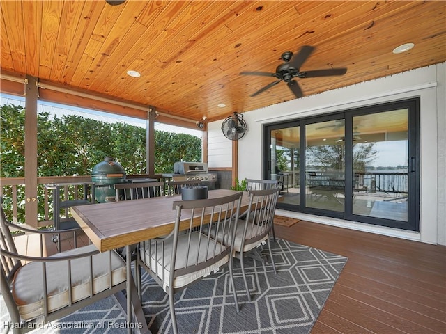 sunroom featuring wooden ceiling and ceiling fan