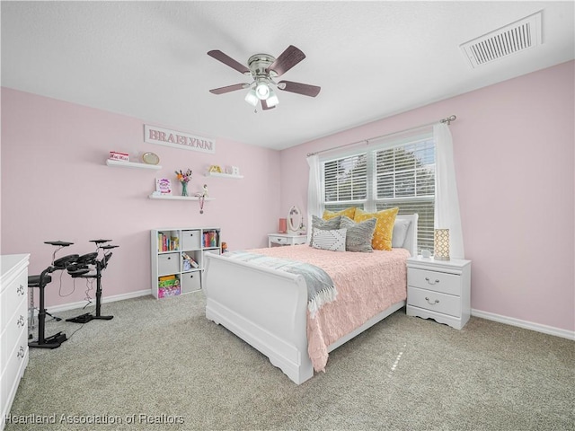 bedroom with ceiling fan, carpet floors, visible vents, and baseboards