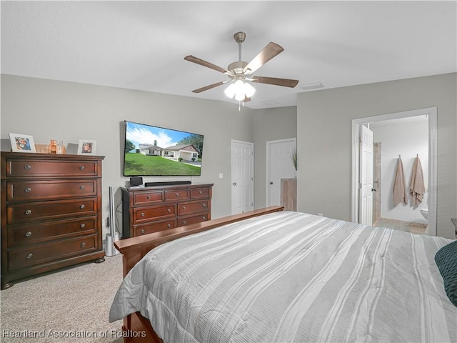 bedroom with a ceiling fan, light colored carpet, and visible vents