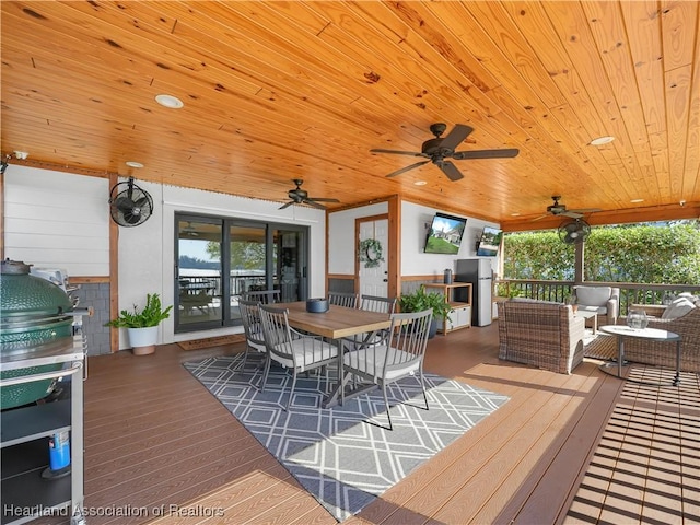 wooden deck with a grill, an outdoor hangout area, and ceiling fan