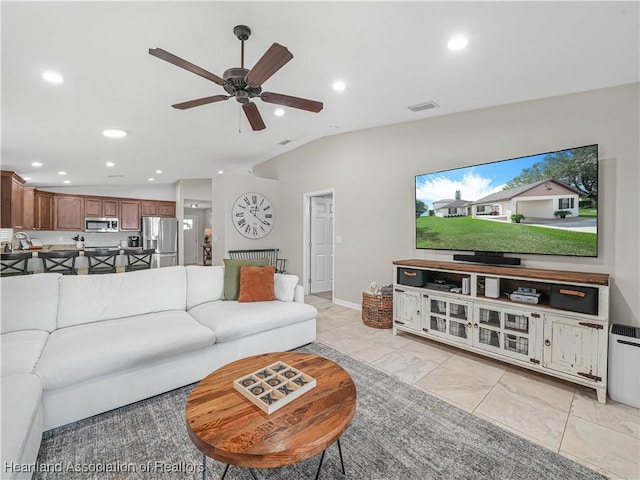 living area with lofted ceiling, ceiling fan, recessed lighting, visible vents, and baseboards