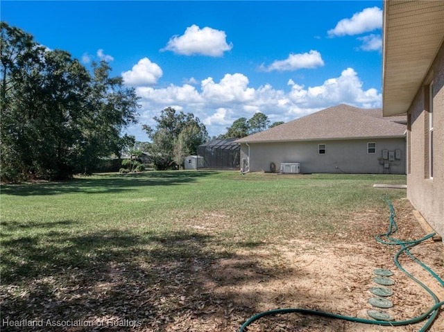 view of yard with central AC