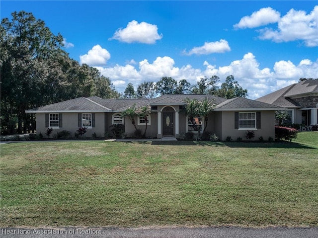 ranch-style house featuring a front lawn