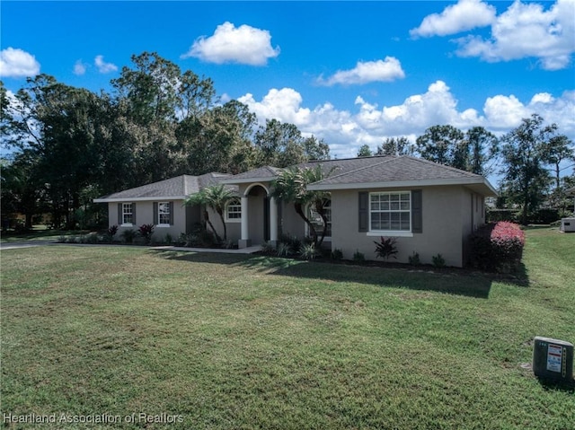 single story home with a front lawn