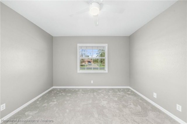 carpeted empty room with ceiling fan