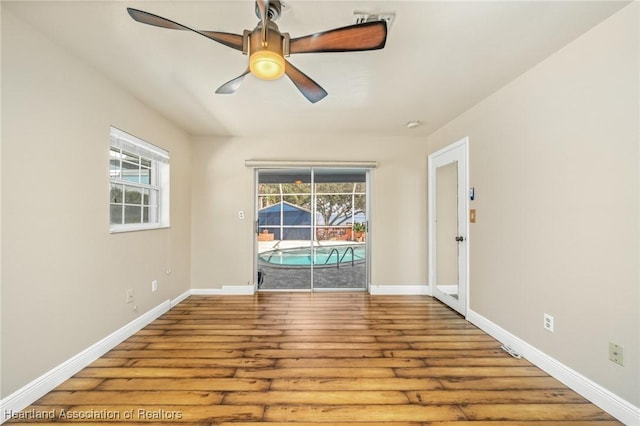 unfurnished room featuring ceiling fan and wood-type flooring