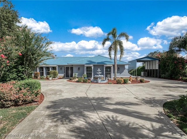 ranch-style house featuring a carport