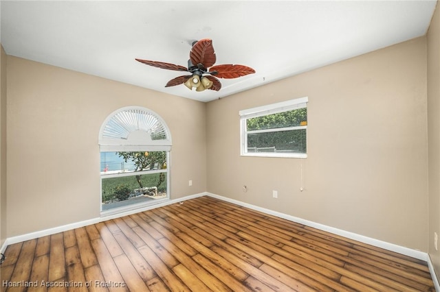 spare room with wood-type flooring