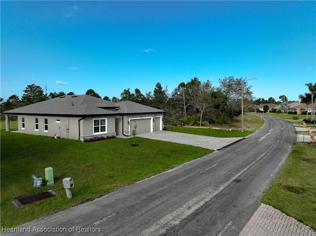 4737 Myrtle Dr, Sebring, FL 33872 - single story home with a garage, driveway, a front yard, stucco siding, and a shingled roof