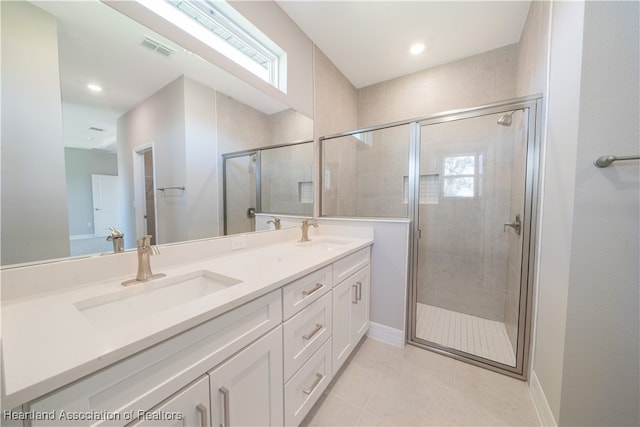 4737 Myrtle Dr, Sebring, FL 33872 - bathroom featuring double vanity, a shower stall, tile patterned flooring, and recessed lighting