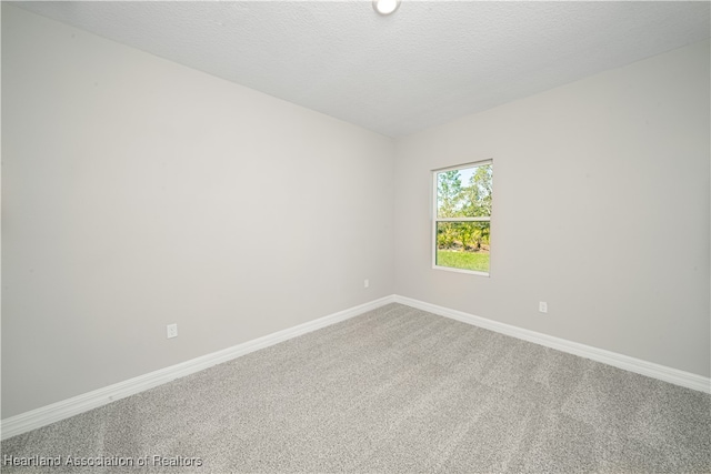 4737 Myrtle Dr, Sebring, FL 33872 - carpeted spare room with baseboards and a textured ceiling