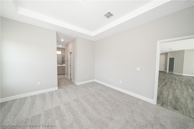4737 Myrtle Dr, Sebring, FL 33872 - spare room with a raised ceiling, recessed lighting, and light colored carpet
