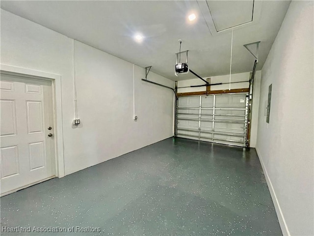 garage featuring a garage door opener and electric panel