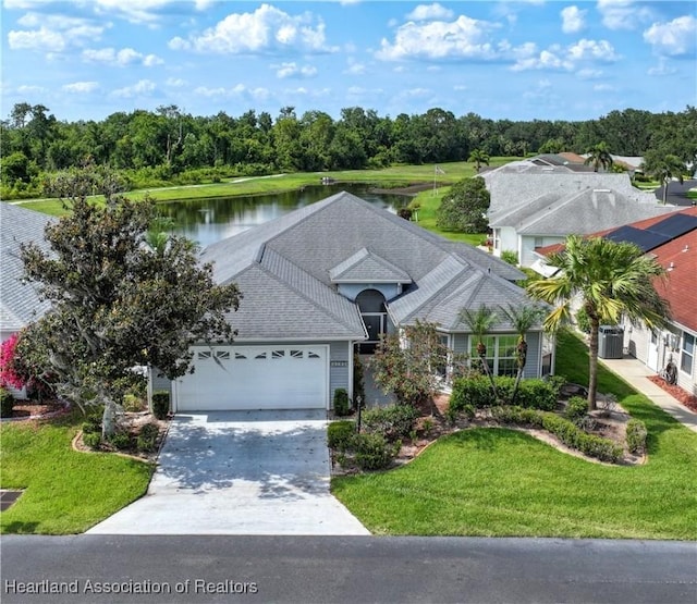 3195 E Pebble Dr, Avon Park, FL 33825 - single story home featuring driveway, an attached garage, a water view, central air condition unit, and a front lawn