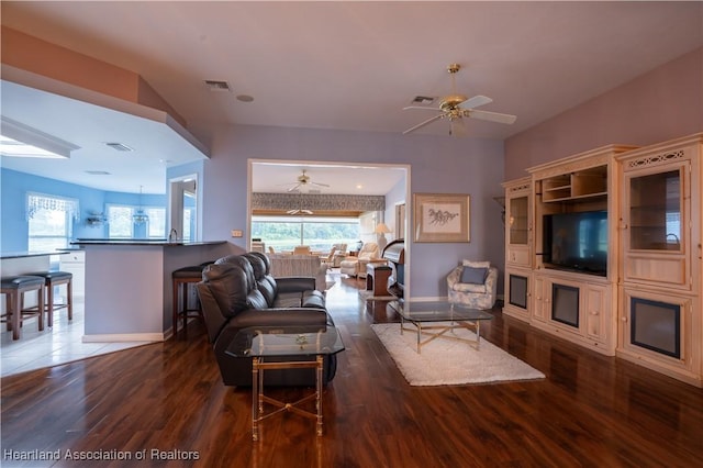 3195 E Pebble Dr, Avon Park, FL 33825 - living room with ceiling fan, dark wood-style flooring, and baseboards