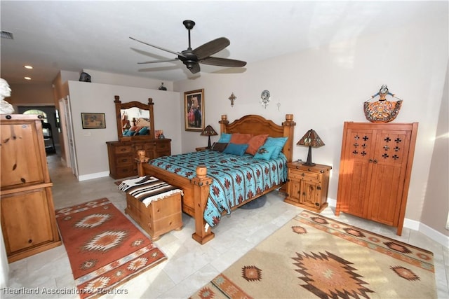 tiled bedroom featuring ceiling fan