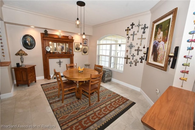 dining room featuring ornamental molding