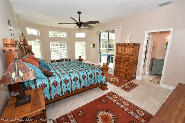 bedroom featuring ceiling fan, access to exterior, light tile patterned floors, and connected bathroom