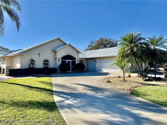 single story home with a front yard and a garage