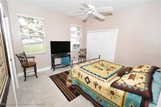 bedroom featuring ceiling fan and a closet