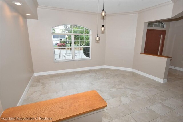 dining area featuring ceiling fan, sink, and a high ceiling