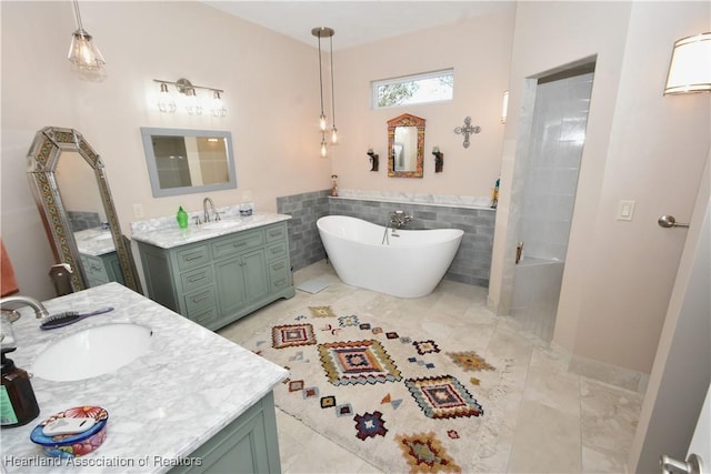 bathroom featuring vanity, tile walls, and plus walk in shower