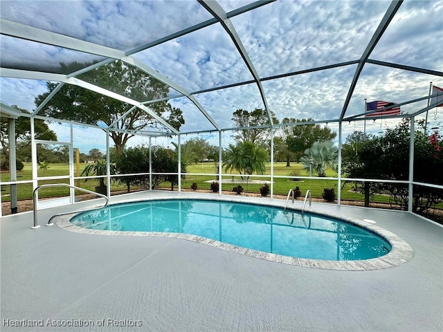 view of pool with a lanai