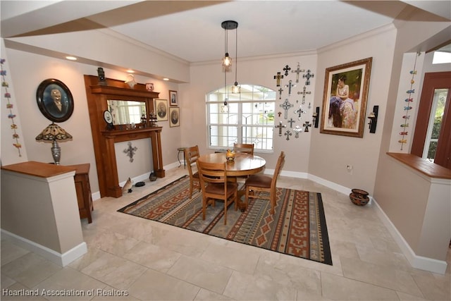 dining area featuring crown molding