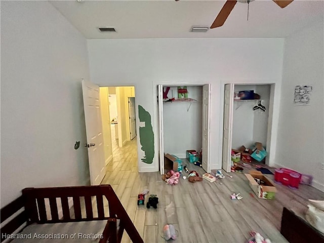 bedroom with hardwood / wood-style floors and ceiling fan