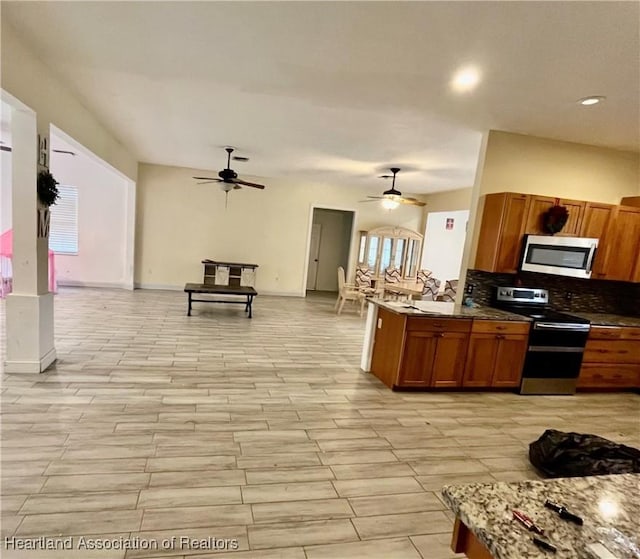 kitchen with tasteful backsplash and stainless steel appliances