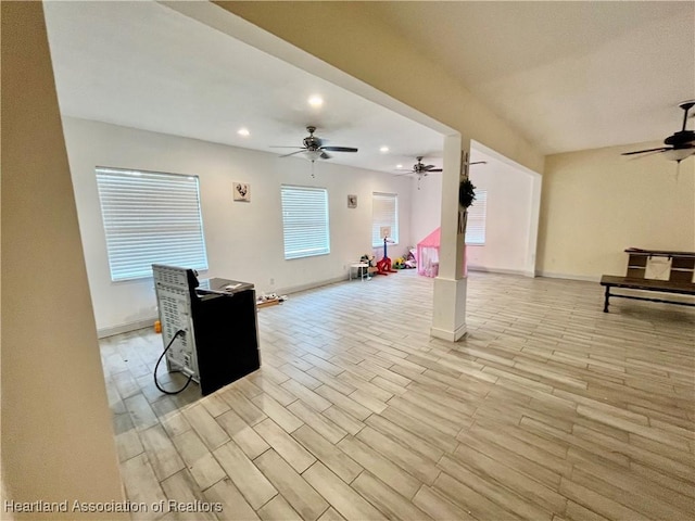 unfurnished living room featuring ceiling fan