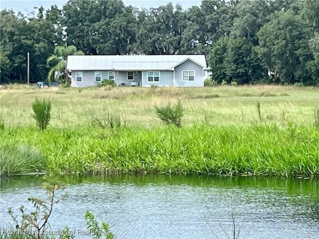 back of property with a water view