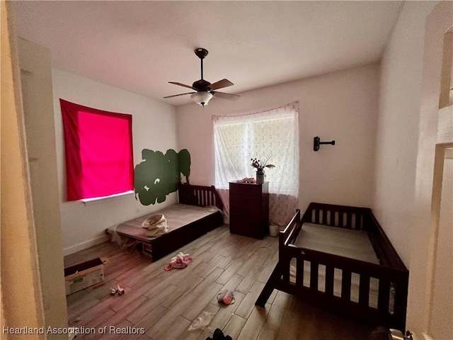 bedroom featuring ceiling fan and wood-type flooring