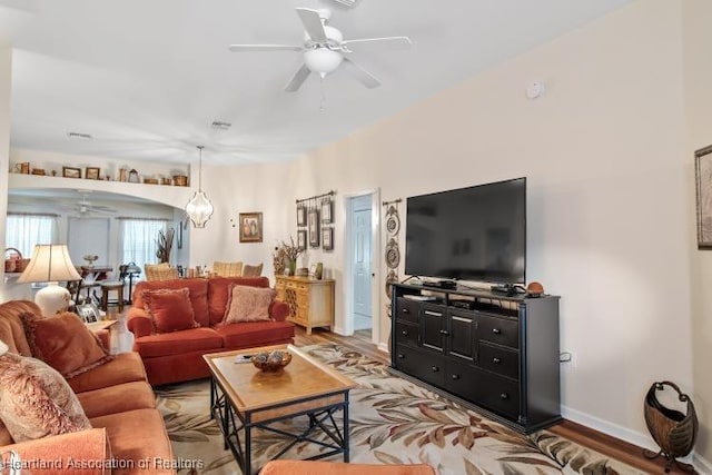 2033 Ashley Oaks Cir, Sebring, FL 33870 - living area with light wood-type flooring, baseboards, and ceiling fan